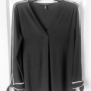 Stylish B&W Statement Blouse with Playful Cuffs